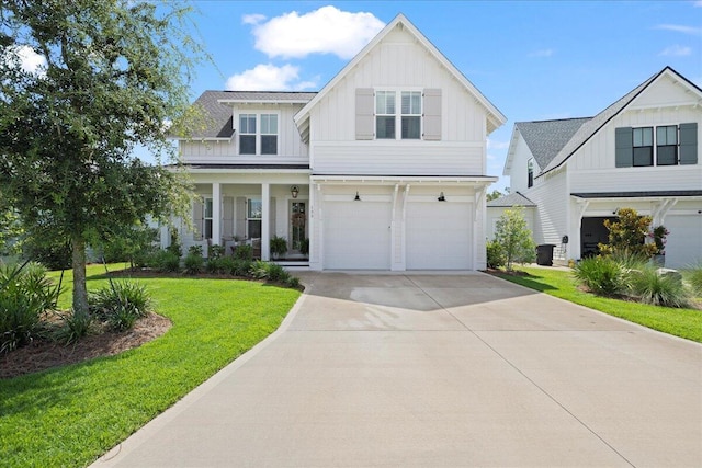 133 E Firethorn Cir, Inlet Beach, FL 32461 - modern farmhouse style home with board and batten siding, a garage, driveway, and a front lawn