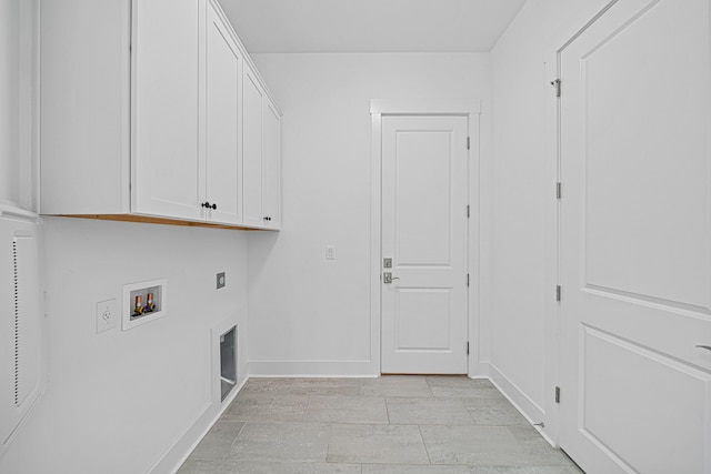 128 Ravine Rd, Watersound, FL 32461 - washroom with cabinet space, electric dryer hookup, and hookup for a washing machine