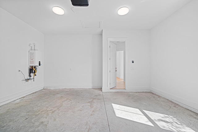 128 Ravine Rd, Watersound, FL 32461 - spare room featuring concrete flooring and attic access