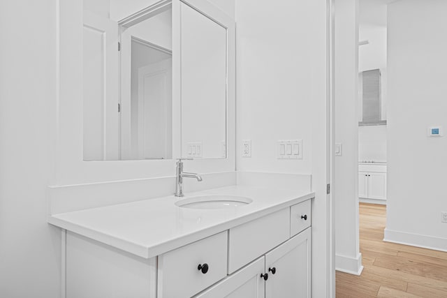 128 Ravine Rd, Watersound, FL 32461 - bathroom featuring vanity and wood finished floors
