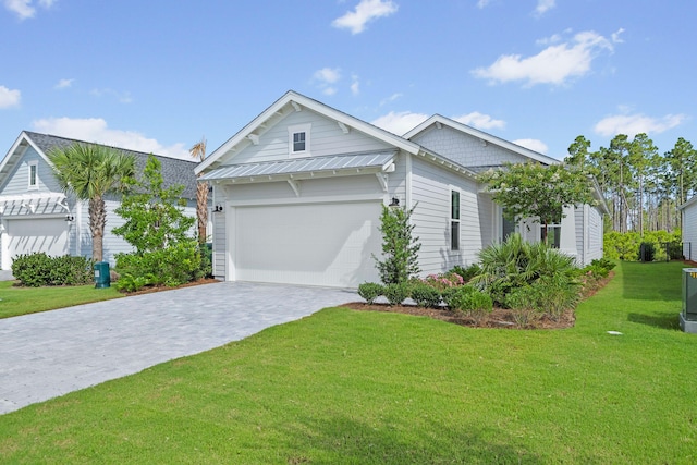 128 Ravine Rd, Watersound, FL 32461 - view of front facade featuring a front yard and decorative driveway