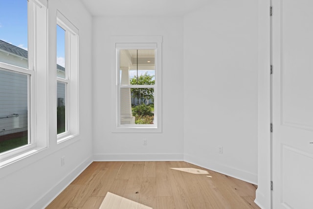 128 Ravine Rd, Watersound, FL 32461 - empty room with light wood-type flooring and baseboards
