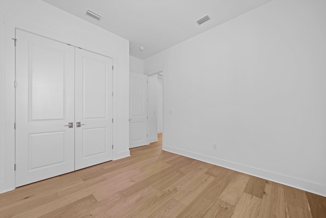 128 Ravine Rd, Watersound, FL 32461 - unfurnished bedroom featuring light wood-style floors and a closet