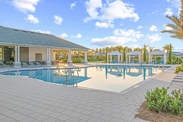 128 Ravine Rd, Watersound, FL 32461 - community pool with a gazebo and a patio