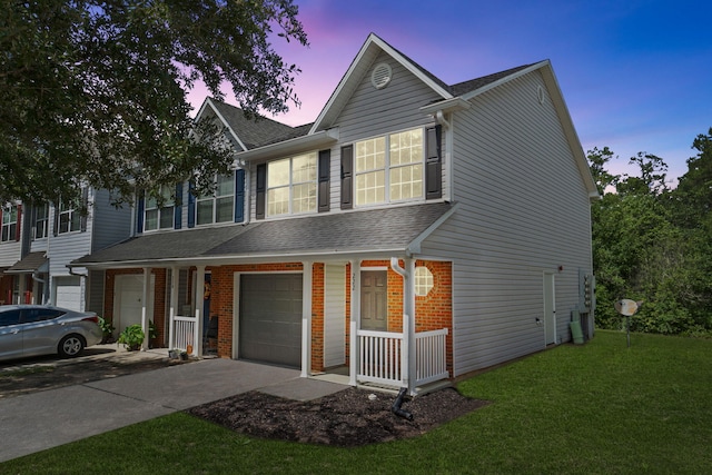 222 Swaying Pine Ct, Crestview, FL 32539 - view of front of home with an attached garage, a porch, asphalt driveway, roof with shingles, and a front yard