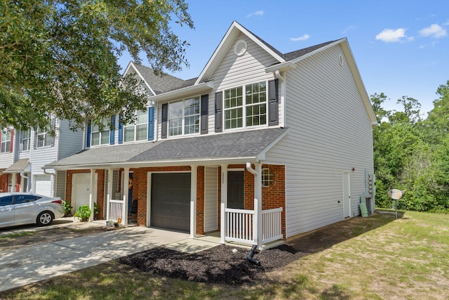 222 Swaying Pine Ct, Crestview, FL 32539 - view of front of home featuring a porch, an attached garage, roof with shingles, driveway, and brick siding
