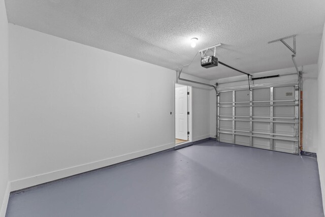 222 Swaying Pine Ct, Crestview, FL 32539 - garage with a garage door opener and baseboards