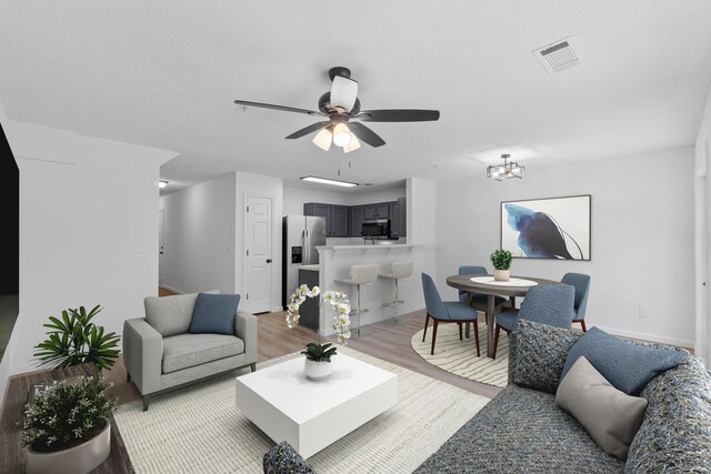 222 Swaying Pine Ct, Crestview, FL 32539 - living area with light wood-style flooring and a ceiling fan