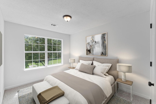 222 Swaying Pine Ct, Crestview, FL 32539 - carpeted bedroom featuring a textured ceiling