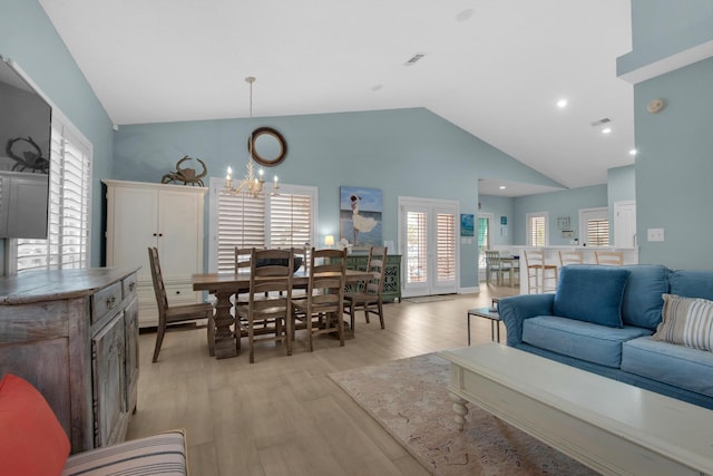 4460 Ocean View Dr, Destin, FL 32541 - living area featuring a chandelier, light wood-type flooring, and high vaulted ceiling