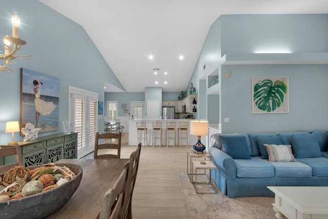 4460 Ocean View Dr, Destin, FL 32541 - living room featuring light wood-style flooring and high vaulted ceiling