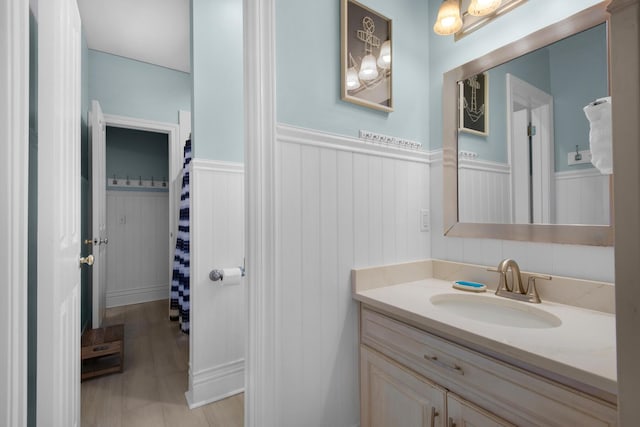 4460 Ocean View Dr, Destin, FL 32541 - bathroom featuring wainscoting and vanity