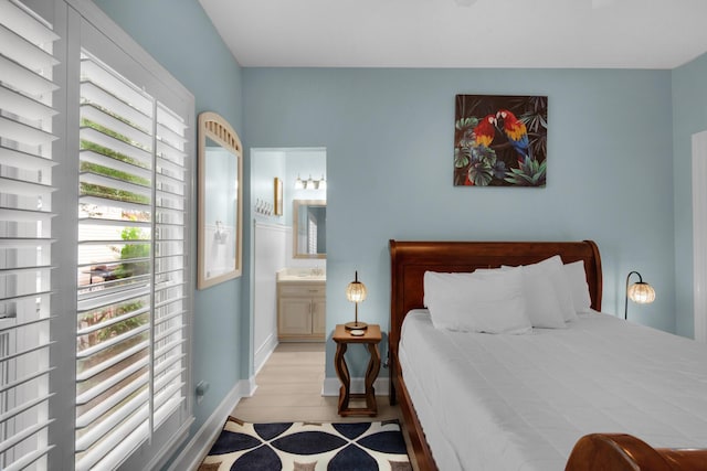 4460 Ocean View Dr, Destin, FL 32541 - bedroom with ensuite bathroom and wood finished floors