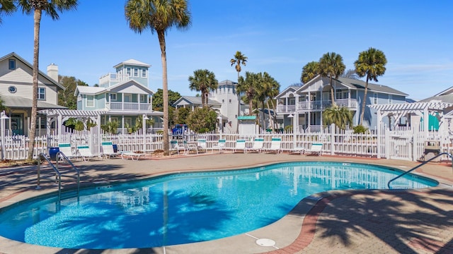 4460 Ocean View Dr, Destin, FL 32541 - community pool featuring a pergola, a patio area, and a residential view
