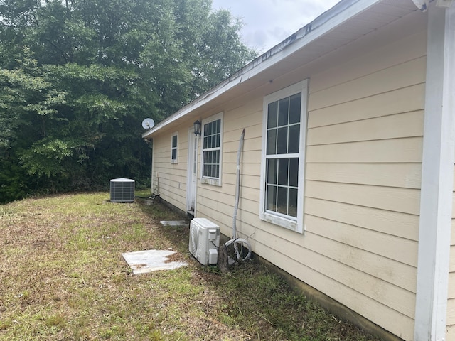 159 Michigan Ln, Defuniak Springs, FL 32433 - view of side of home with an ac unit and a yard