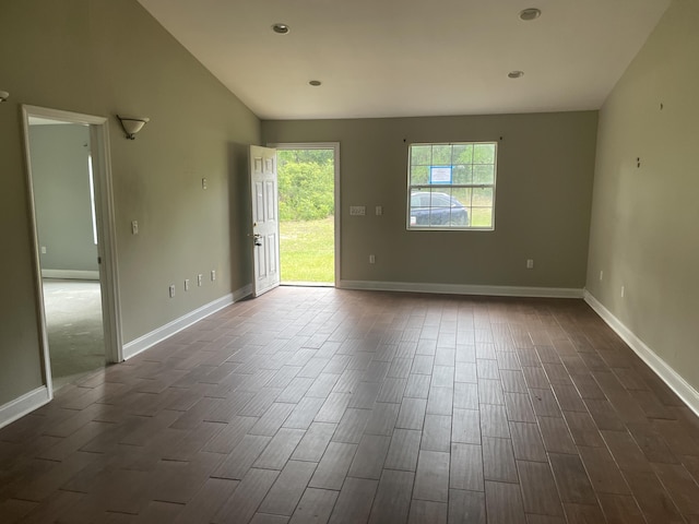 159 Michigan Ln, Defuniak Springs, FL 32433 - spare room with dark wood-style flooring, lofted ceiling, and recessed lighting