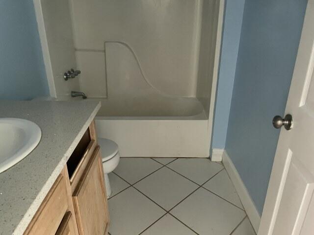 159 Michigan Ln, Defuniak Springs, FL 32433 - full bathroom featuring vanity, tile patterned flooring, and shower / washtub combination