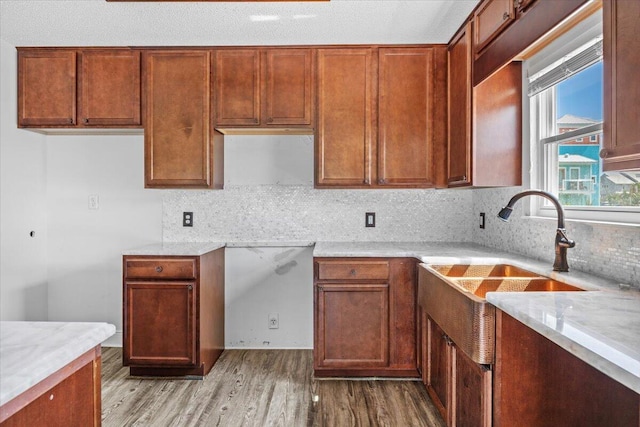 8147 White Sands Blvd, Navarre, FL 32566 - kitchen with wood finished floors, tasteful backsplash, and light countertops