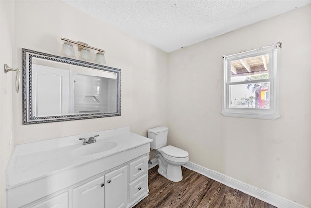 8147 White Sands Blvd, Navarre, FL 32566 - bathroom featuring vanity, wood finished floors, and a textured ceiling