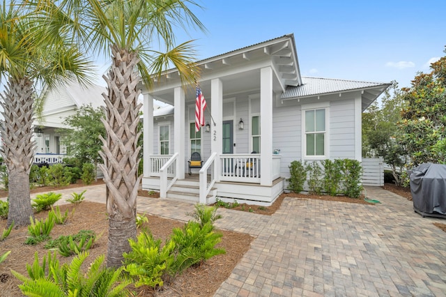 22 Cypress Rdg, Santa Rosa Beach, FL 32459 - view of front of house featuring covered porch and a metal roof
