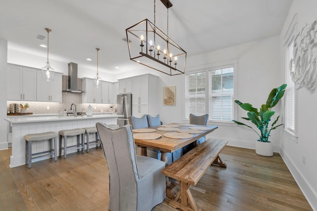 22 Cypress Rdg, Santa Rosa Beach, FL 32459 - dining space featuring wood finished floors, recessed lighting, and a chandelier