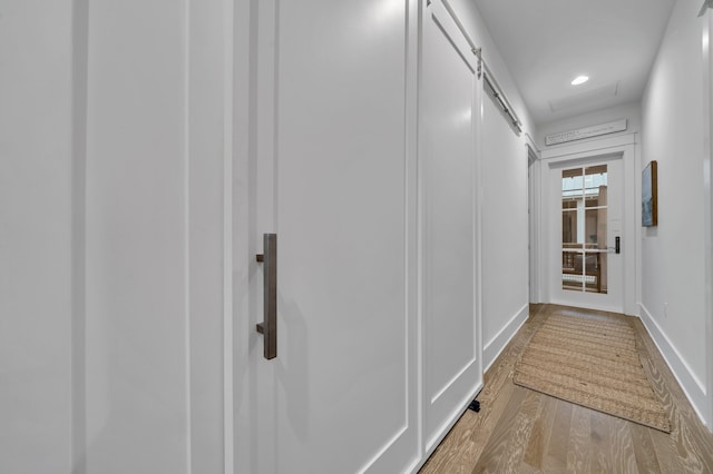 22 Cypress Rdg, Santa Rosa Beach, FL 32459 - hall featuring wood finished floors and a barn door
