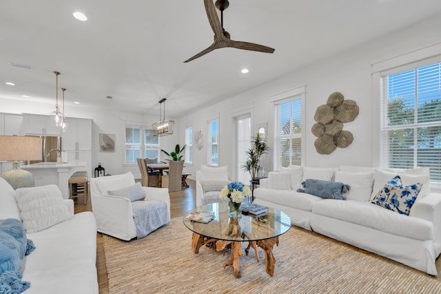 22 Cypress Rdg, Santa Rosa Beach, FL 32459 - living room with healthy amount of natural light, recessed lighting, ceiling fan, light wood-style flooring, and a chandelier