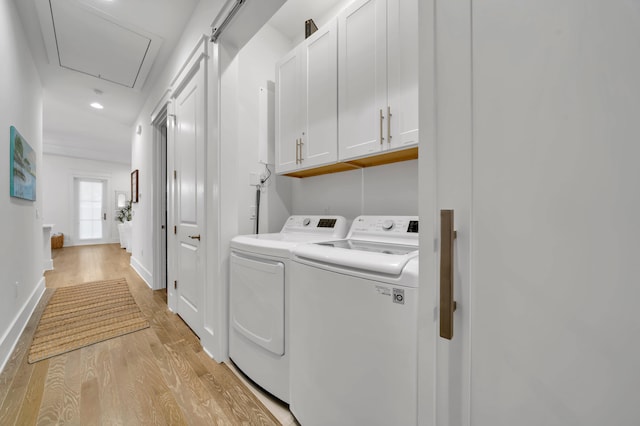22 Cypress Rdg, Santa Rosa Beach, FL 32459 - laundry area with washer and dryer, attic access, light wood finished floors, cabinet space, and recessed lighting