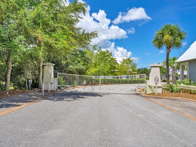 22 Cypress Rdg, Santa Rosa Beach, FL 32459 - view of asphalt street with a gate and a gated entry