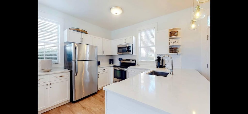 198 Somerset Bridge Rd Unit 143, Santa Rosa Beach, FL 32459 - kitchen featuring stainless steel appliances, plenty of natural light, and white cabinets
