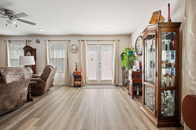 4649 Naval Ct, Crestview, FL 32539 - living area with wood finished floors, ceiling fan, a textured ceiling, french doors, and recessed lighting
