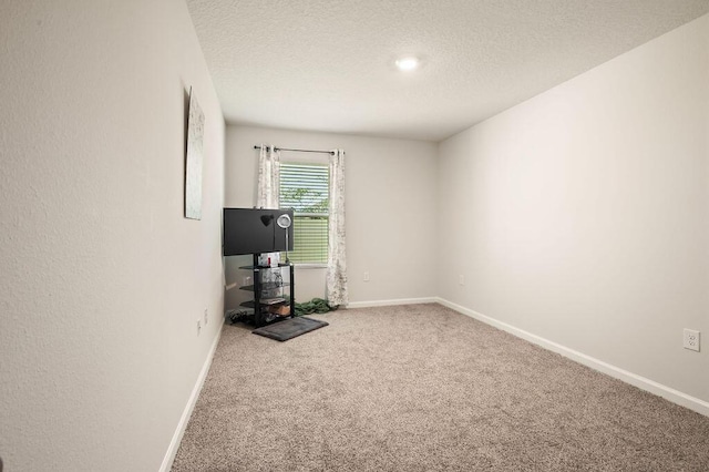 4649 Naval Ct, Crestview, FL 32539 - carpeted spare room with a textured ceiling and baseboards