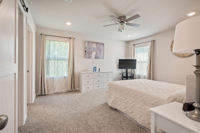 4649 Naval Ct, Crestview, FL 32539 - bedroom with carpet floors, recessed lighting, a textured ceiling, and a ceiling fan