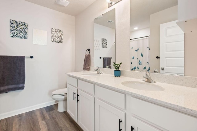 4649 Naval Ct, Crestview, FL 32539 - full bath with double vanity, wood finished floors, and a shower with curtain