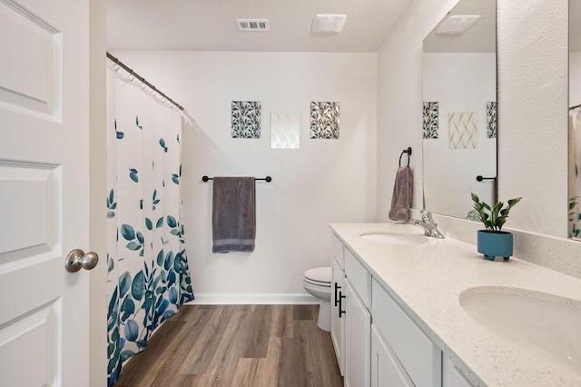 4649 Naval Ct, Crestview, FL 32539 - full bathroom with double vanity, wood finished floors, and curtained shower