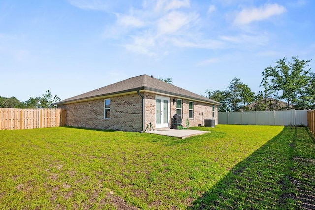 4649 Naval Ct, Crestview, FL 32539 - back of house featuring brick siding, a fenced backyard, and a patio