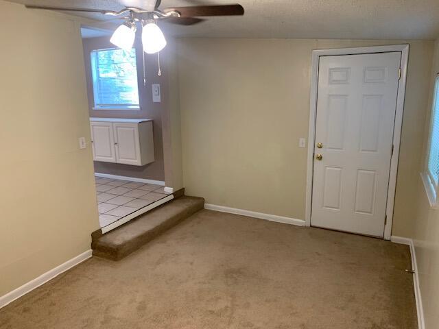 947 Don Dr, Fort Walton Beach, FL 32547 - carpeted spare room featuring ceiling fan and baseboards