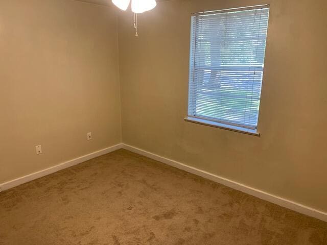 947 Don Dr, Fort Walton Beach, FL 32547 - carpeted spare room with baseboards and a ceiling fan