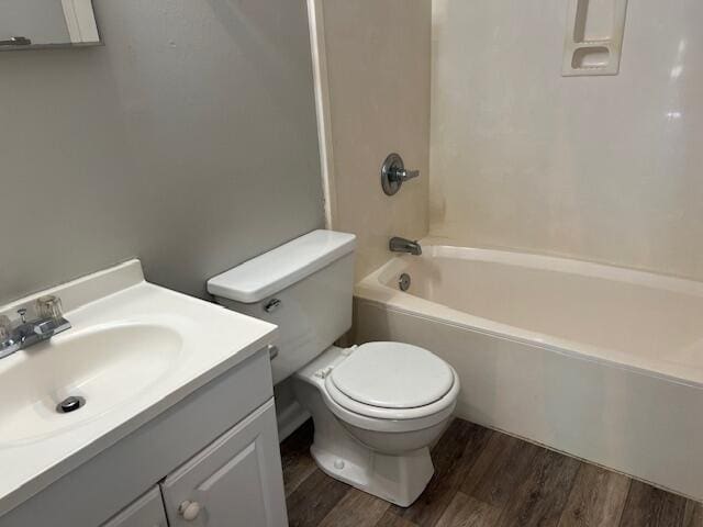 947 Don Dr, Fort Walton Beach, FL 32547 - bathroom with wood finished floors, vanity, and shower / tub combination