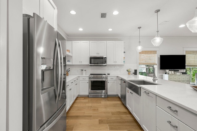499 Patina Blvd, Inlet Beach, FL 32461 - kitchen featuring stainless steel appliances, open shelves, white cabinets, backsplash, and pendant lighting