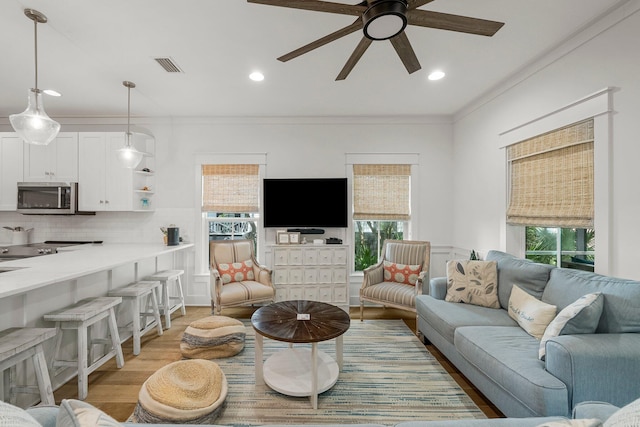 499 Patina Blvd, Inlet Beach, FL 32461 - living room featuring ceiling fan, light wood-style floors, crown molding, and recessed lighting