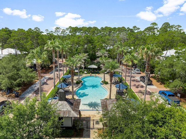 499 Patina Blvd, Inlet Beach, FL 32461 - community pool with view of wooded area, a patio area, and a gate