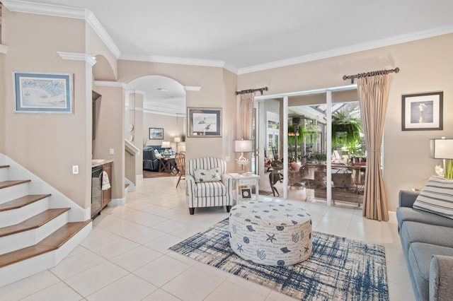 6341 Augusta Cv, Destin, FL 32541 - living room with ornamental molding, light tile patterned flooring, stairs, and arched walkways