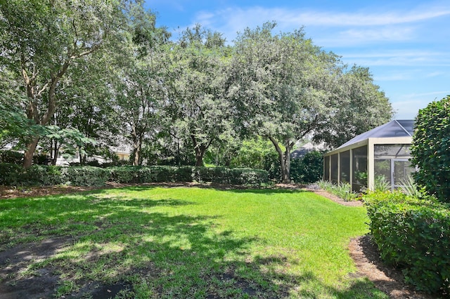6341 Augusta Cv, Destin, FL 32541 - view of green lawn with a lanai