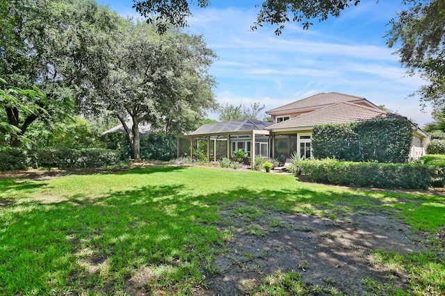 6341 Augusta Cv, Destin, FL 32541 - view of green lawn featuring a lanai
