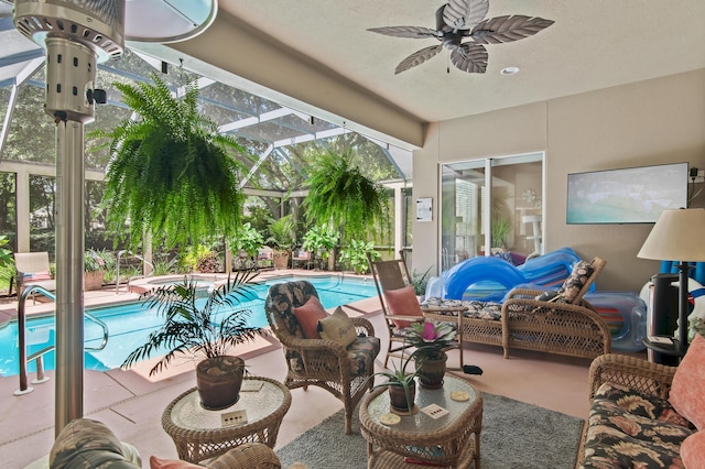 6341 Augusta Cv, Destin, FL 32541 - swimming pool featuring a ceiling fan, a patio, glass enclosure, and an outdoor hot tub