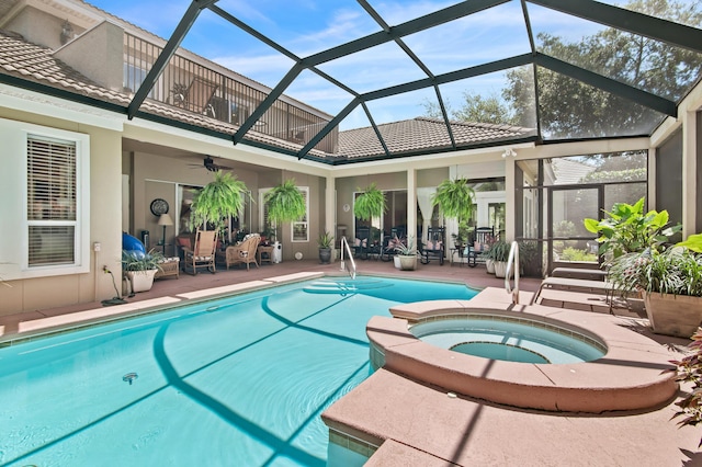 6341 Augusta Cv, Destin, FL 32541 - view of swimming pool featuring ceiling fan, a patio area, a pool with connected hot tub, and glass enclosure
