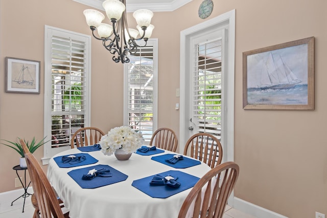 6341 Augusta Cv, Destin, FL 32541 - dining area with a chandelier, plenty of natural light, crown molding, and tile patterned floors