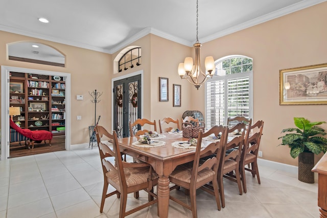 6341 Augusta Cv, Destin, FL 32541 - dining space with a chandelier, light tile patterned flooring, ornamental molding, and recessed lighting