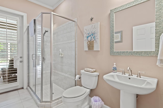 6341 Augusta Cv, Destin, FL 32541 - bathroom with ornamental molding, a stall shower, and tile patterned floors